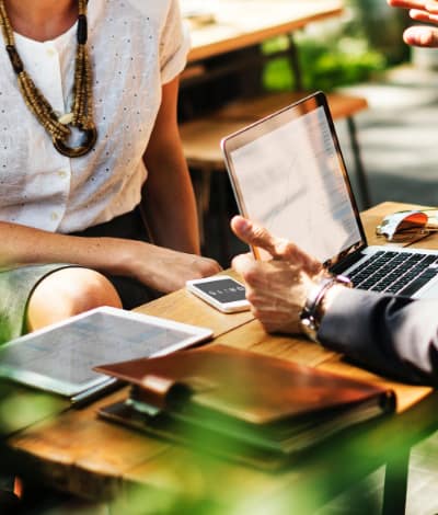 two people having a meeting outdoors